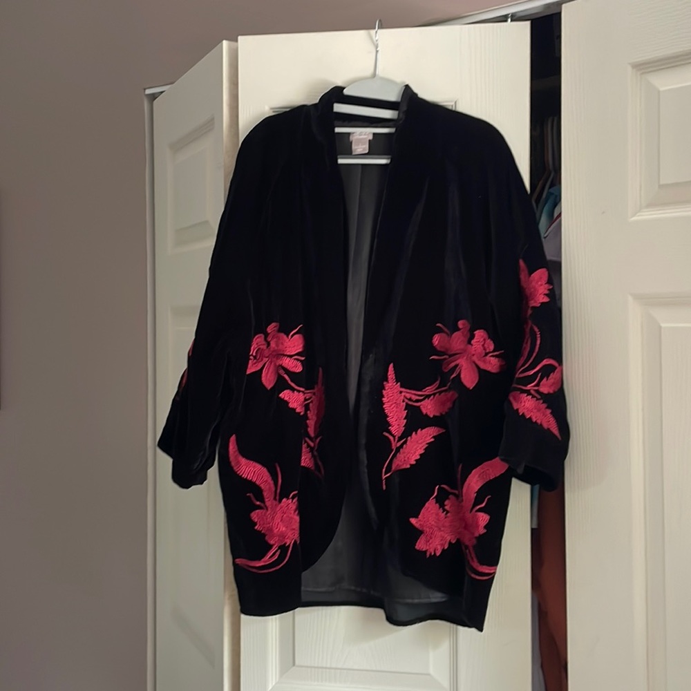 Black suede jacket with red stitching